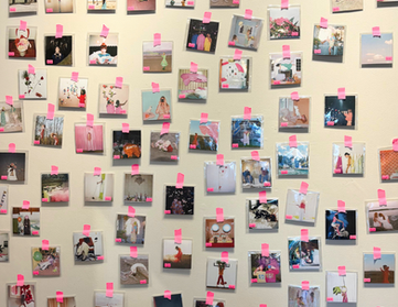 ashley sophia clark photography all over a wall at fine art fruit shop in portland