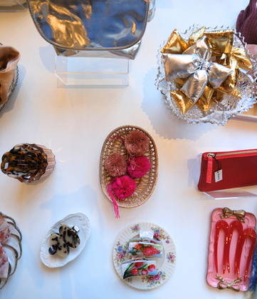 silver handbag and red and gold hair pieces at fine art fruit shop in portland