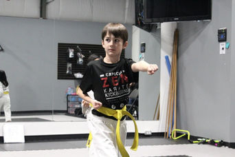 Beginner kids karate class in Calgary focusing on discipline and basic techniques.