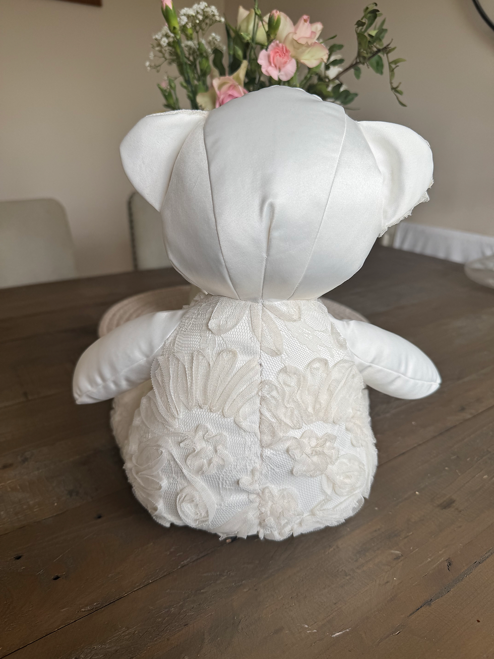 Thumbnail: Side  view of a wedding dress keepsake bear with the skirt removed