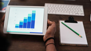 Person analysing website performance on Google Analytics dashboard
