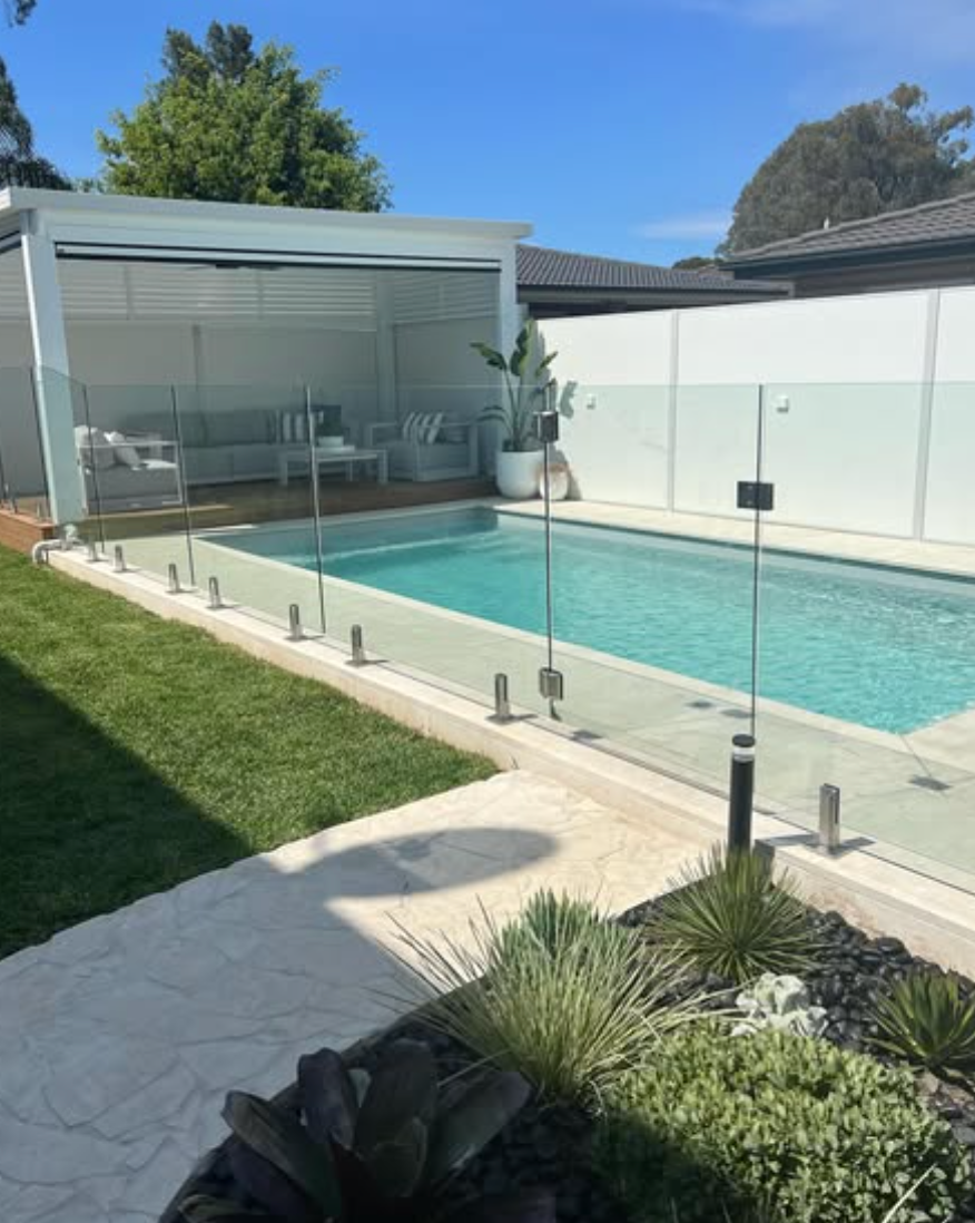 Outdoor pool tiling and stone surround installation in St Clair, NSW