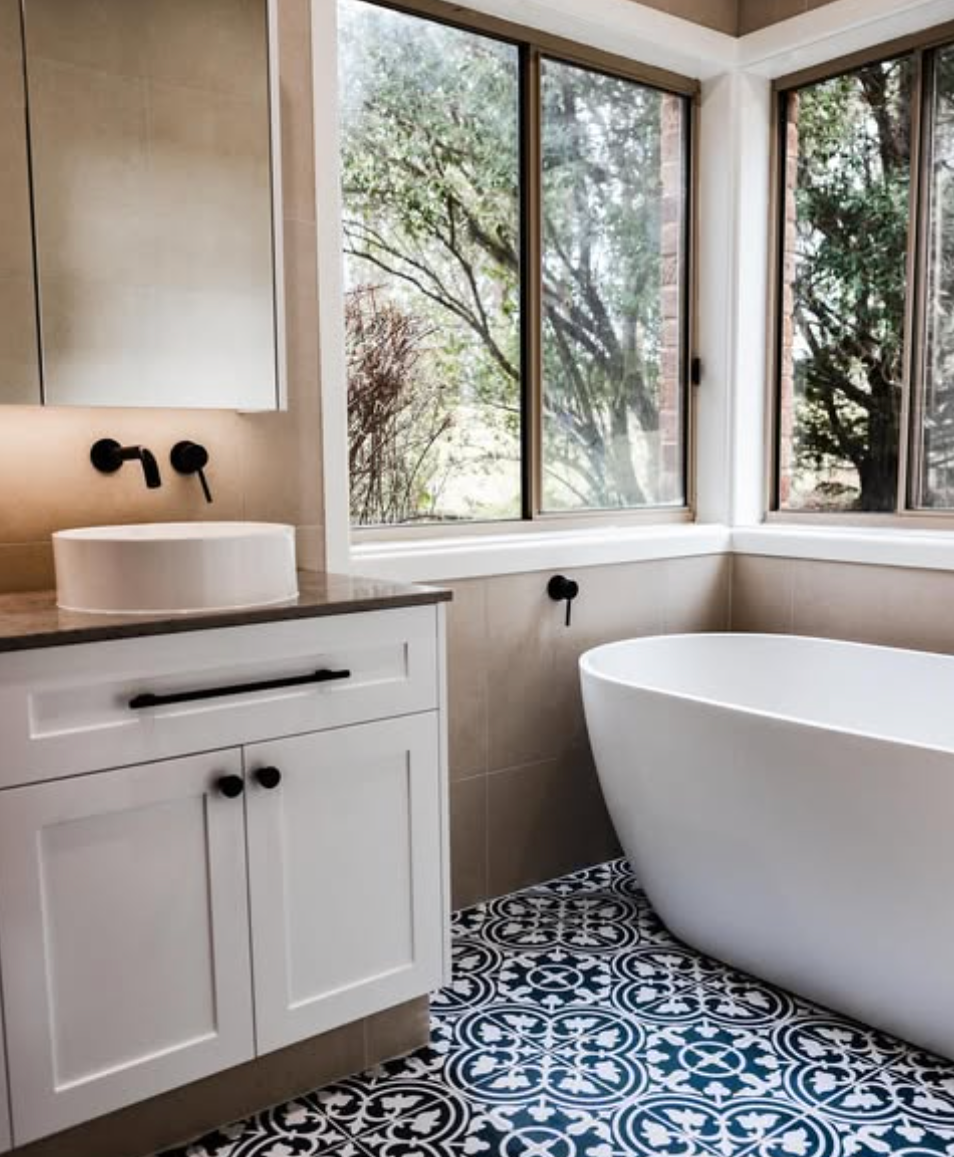 Bathroom renovation in Ellis Lane featuring patterned floor tiles and freestanding bath