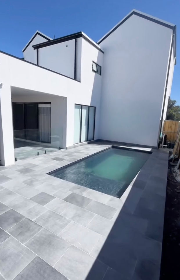 Compact custom concrete pool designed for a premium courtyard setting