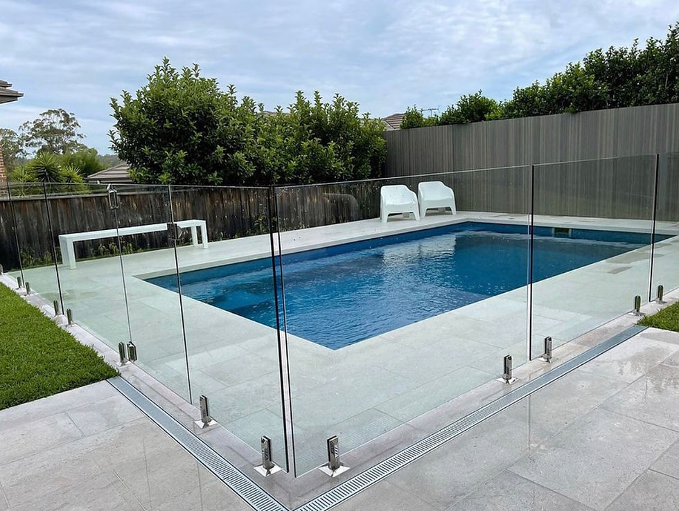 Custom concrete pool with limestone paving in a Hills District family home