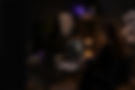 Website designer working late on a premium client website in a modern dark workspace