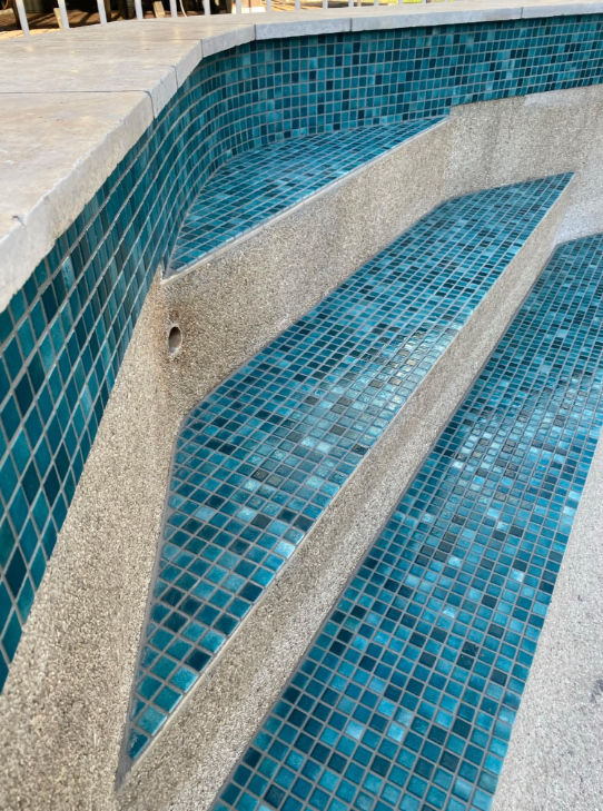 Concrete pool renovation and modern tiling detail completed in 2025