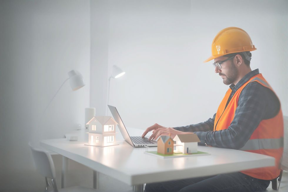 technology coming out of laptop of construction worker to designing a residential housing 