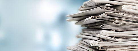 Media & Newroom - stack of newspapers