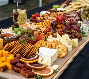 Brunch grazing table with pastries, bagels, fruit, and cheese for corporate event in Chicago