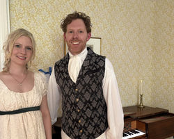 by the piano
