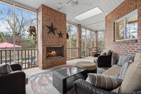 Cozy screened porch with fireplace