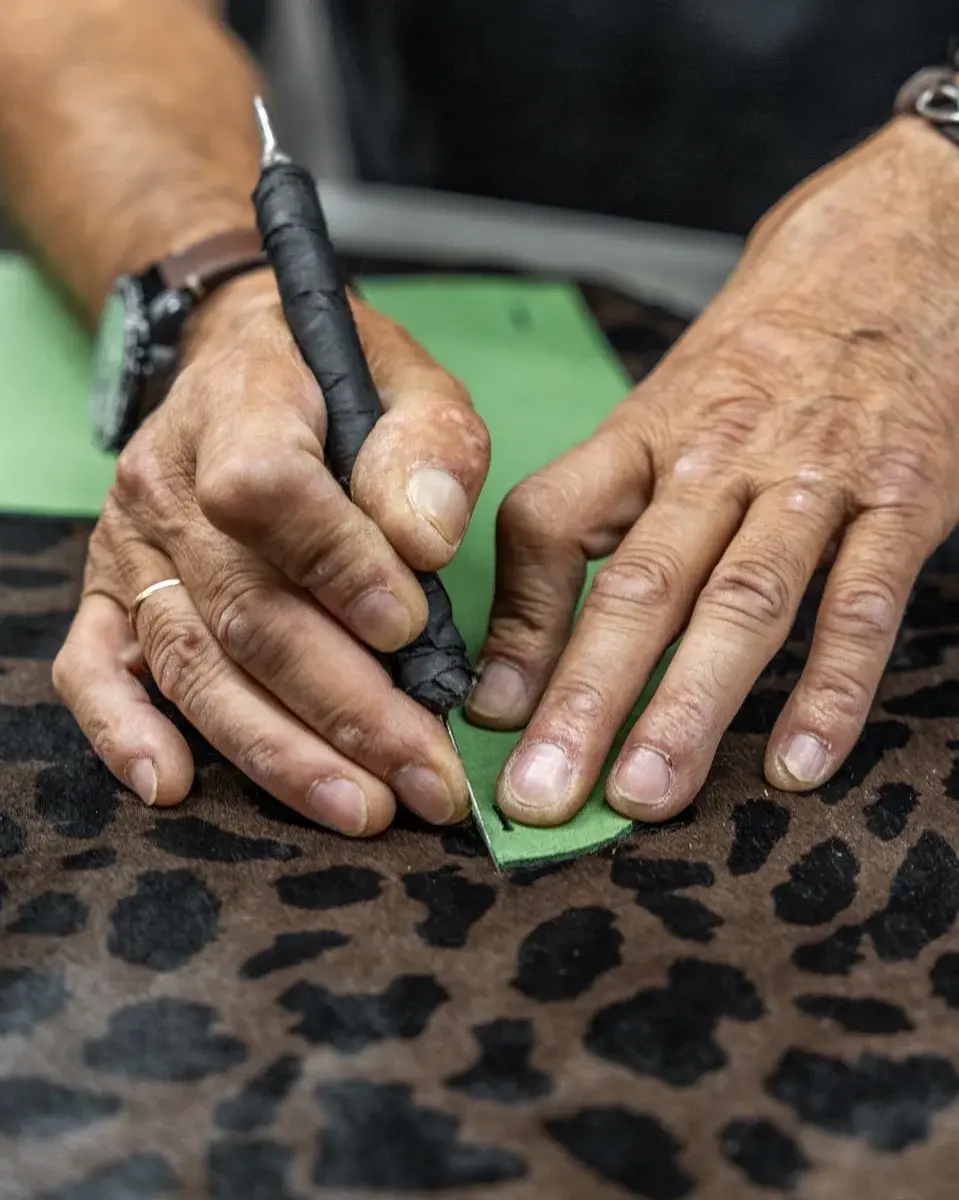 cutting leather at vise footwear production site in portugal