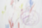 Child scribble on the wall_colored pencils scribbles on a white wall made by a little kid