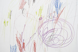 Child scribble on the wall_colored pencils scribbles on a white wall made by a little kid 