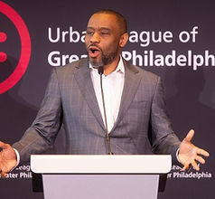 The keynote speaker at the podium at the 2025 Luncheon