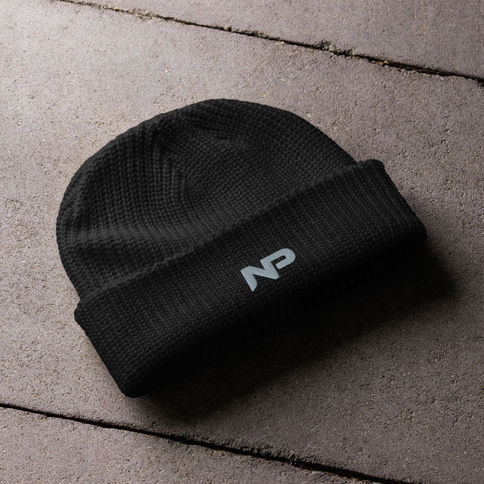 Black Kinetic Shield Beanie, a lightweight training essential with breathable knit construction, a secure fit