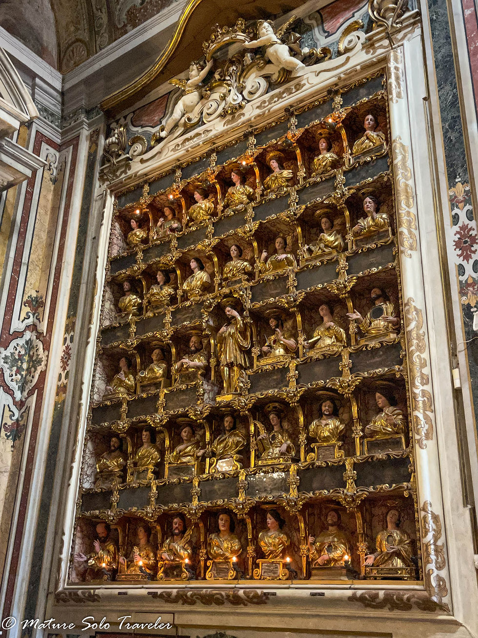 seven wide and five high, this three dimensional set of figurines are all different. Jesus is the central figurine and around half of the singers hold little lit lights
