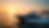 High angle view of a luxury yacht cruising near Newport’s harbor with sunset in the background