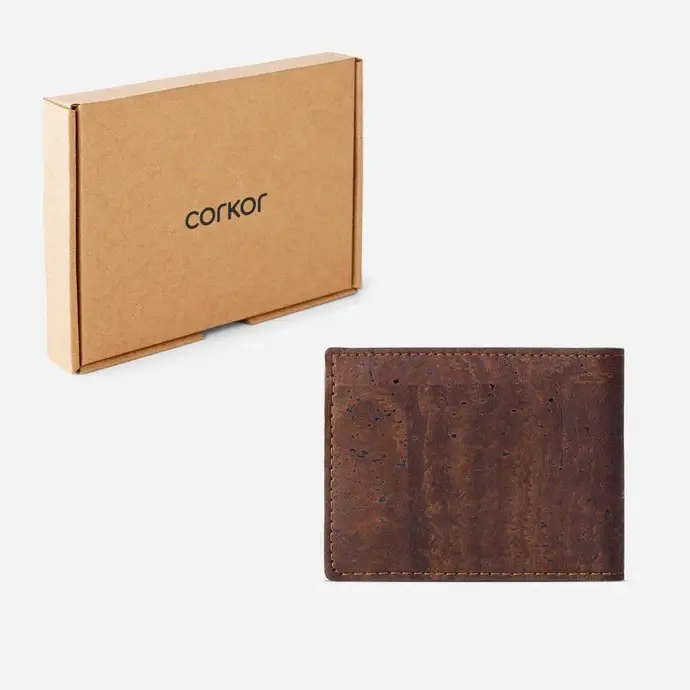 Vegan bifold cork wallet shown next to its eco-friendly and sustainable cardboard packaging.