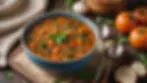 Close-up view of a steaming bowl of homemade vegetable lentil soup