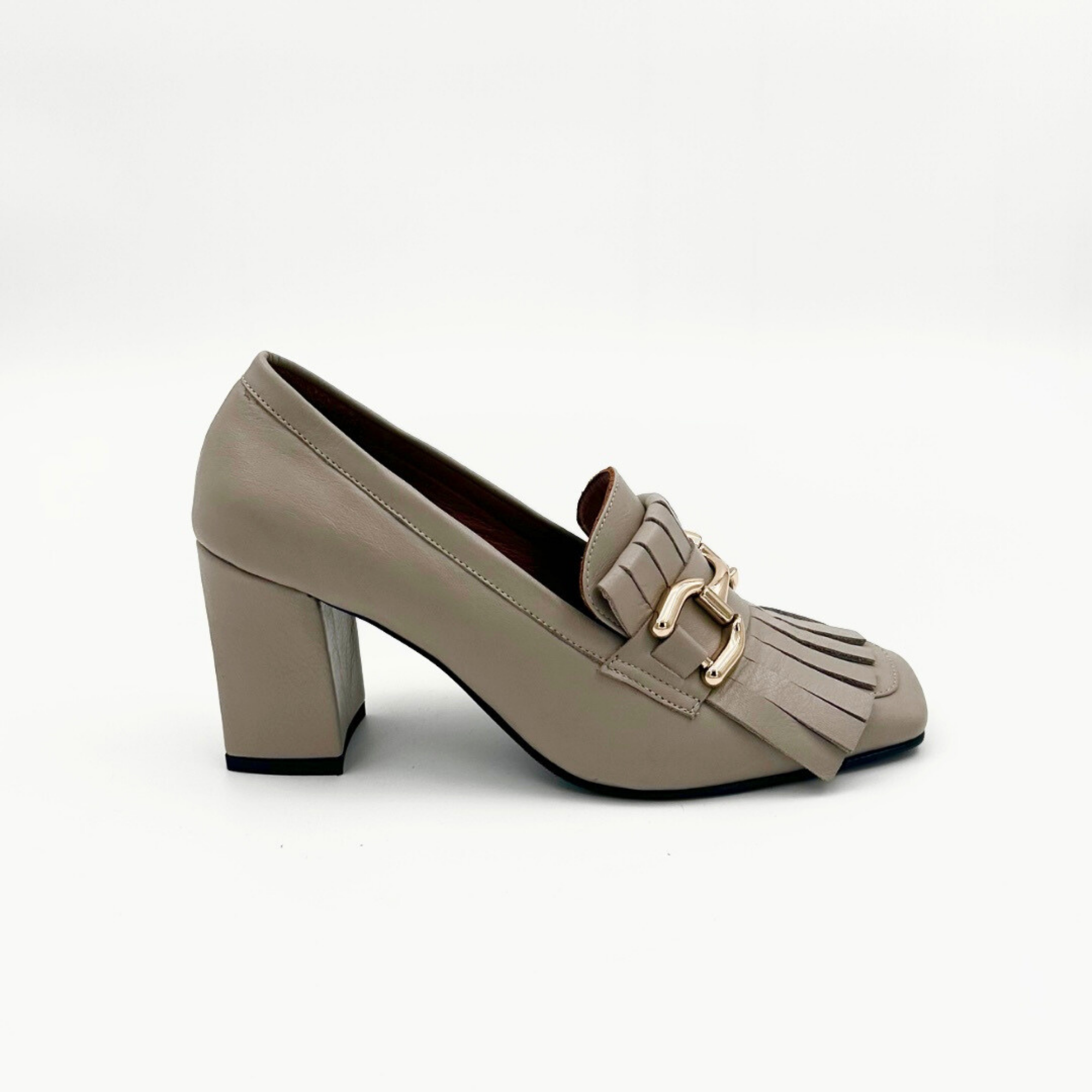 Taupe leather heeled loafer with fringe and gold buckle – side view