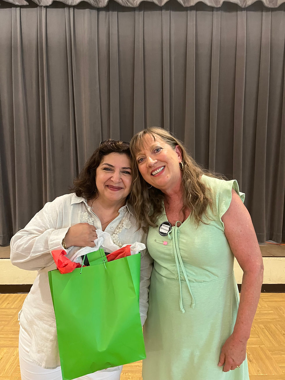 With poet Lena Khalaf Tuffaha after her reading at Saint Andrew's Episcopal Church as part of their "Summer of Palestinian Visibility" series. The poems in her book, "Something About Living" are inspired by her Palestinian, Jordanian and Syrian heritage. In the bag is my gift of a watermelon, a fruit that contains the colors of the Palestinian flag and often used as a symbol of Palestine.