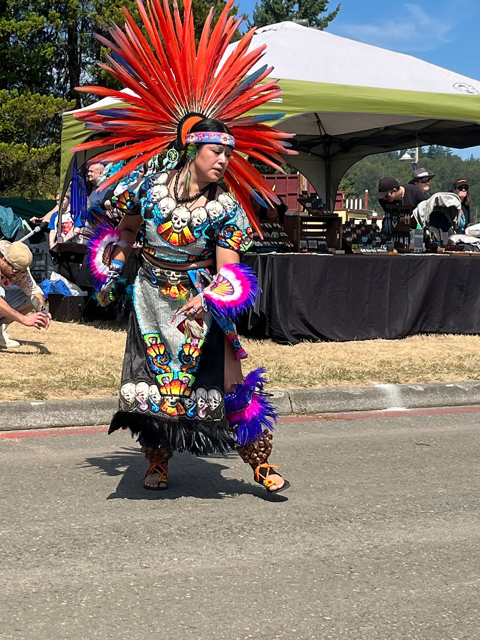 Aztec dancer performing at the fair. The dancers invited people from the audience to join them in a friendship dance, and my daughter and I accepted the invitation!