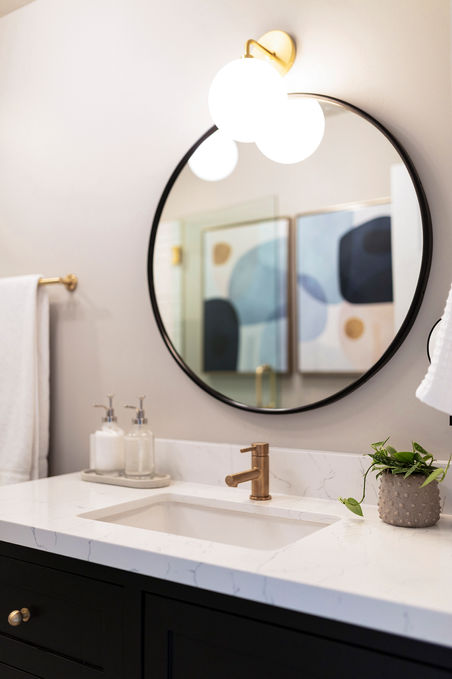 midcentury modern bathroom, black bathroom vanity, brass plumbing, bathroom styling