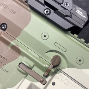 Close-up of a Holosun red dot sight on a BRN-180 rifle
