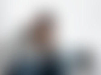 Man sitting alone reflecting after an alcohol relapse