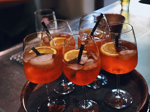 Multiple glasses on a table representing the difficulty of stopping at one drink