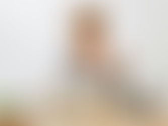 Woman attending an online outpatient alcohol rehab session from home