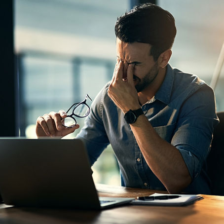 Professional appearing confident at work while privately struggling with alcohol — signs of high-functioning drinking.