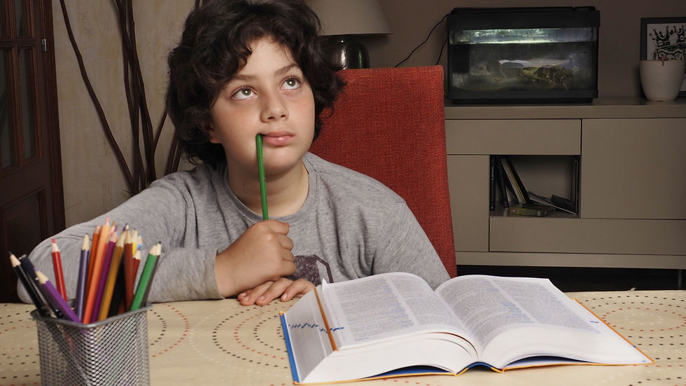 Young child struggling to focus during a learning activity in Bali