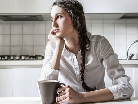 Woman experiencing early sobriety symptoms after quitting alcohol