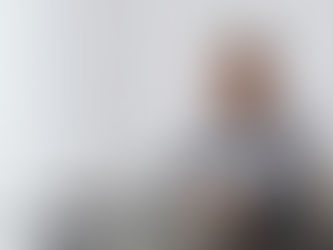 Person attending an online alcohol treatment session from home in the UK using a laptop