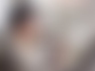 Professional man sitting at home after work considering a drink, representing the habit of drinking after work