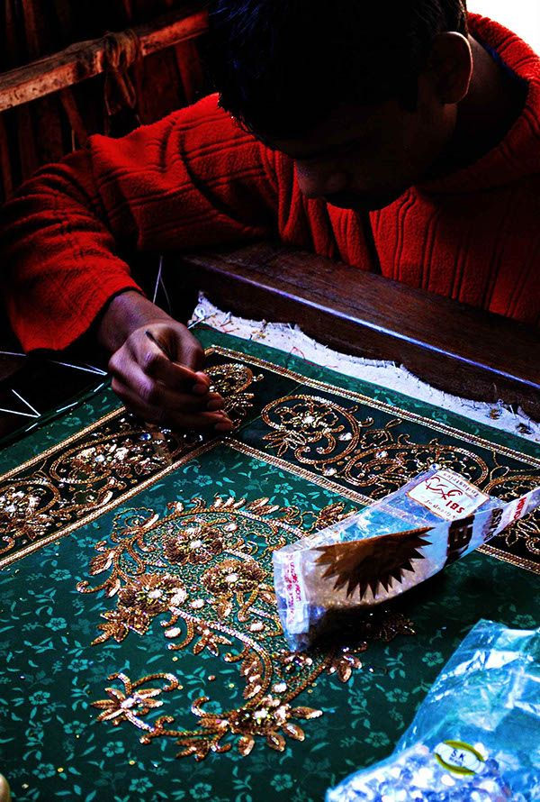 Artisan embroidering Zardozi bridal trousseau