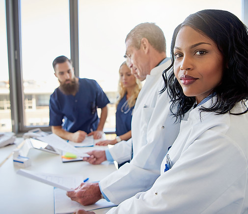 female-doctor-looking-at-camera-in-clini