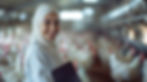 Portrait of a woman wearing a hijab, representing a certified British Montessori teacher with expertise in early childhood education and staff training in Kuwait.