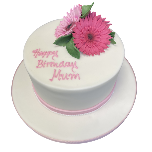 Bespoke cake decorated with vibrant orange and yellow gerbera flowers, crafted for celebration in Solihull, West Midlands.