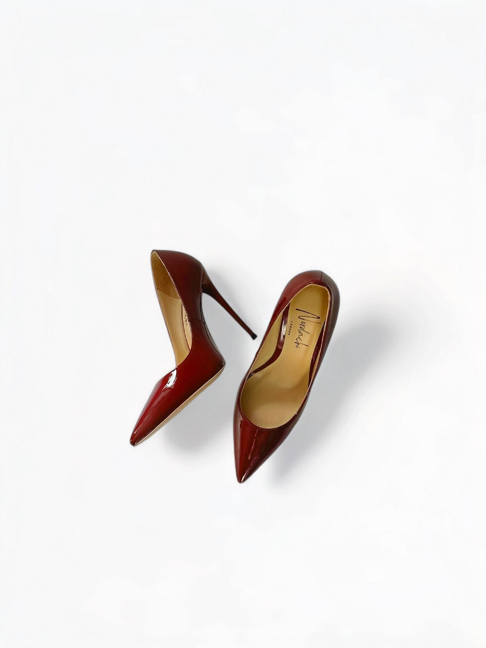 Miniaturbild: Top view of burgundy patent leather fancy stilettos pumps showing pointed toe shape and inner leather lining
