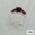 Thumbnail: Three pear-cut garnets in a classic trilogy sterling silver setting