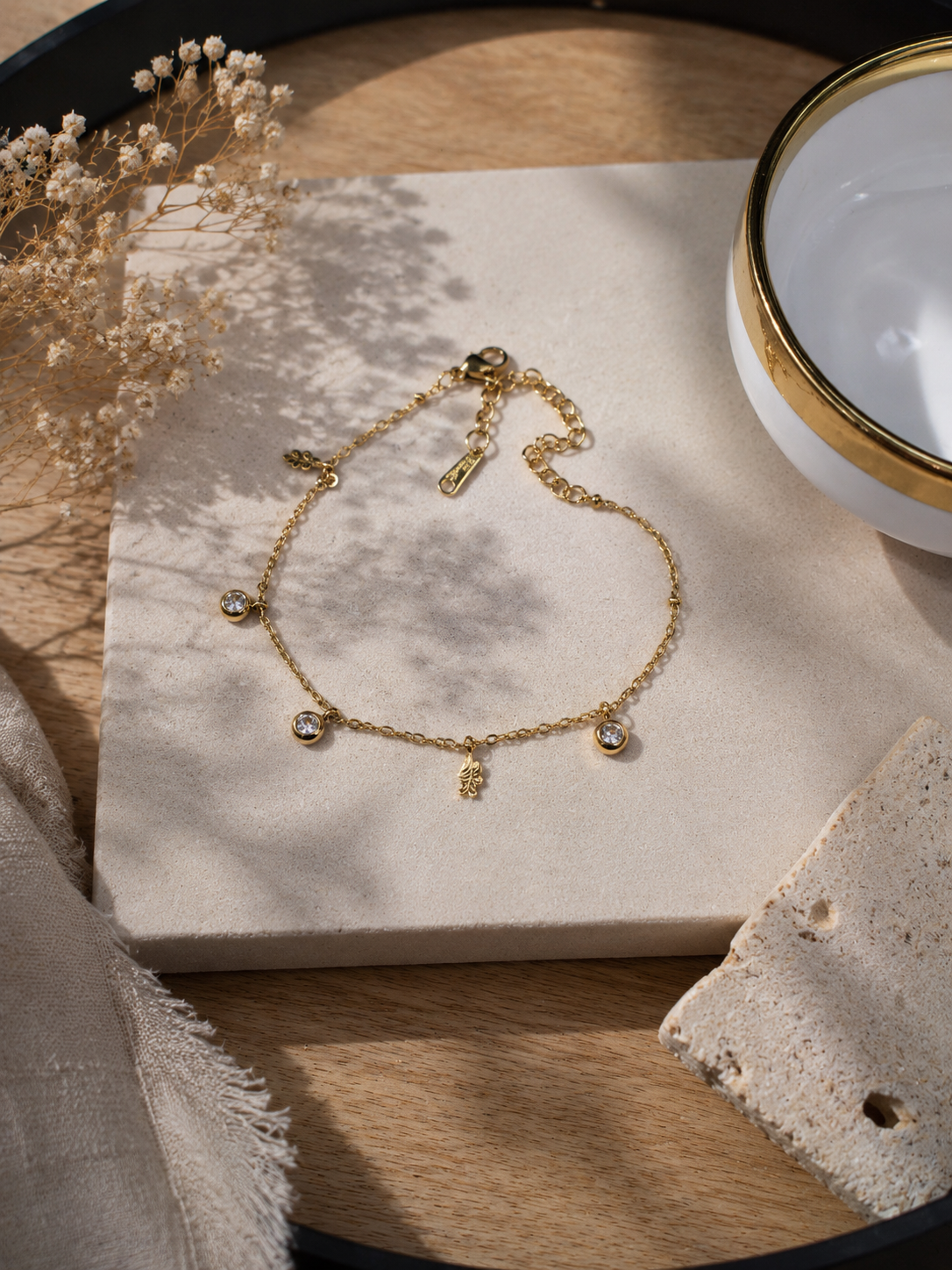 Gold round CZ charm and snake disk bracelet