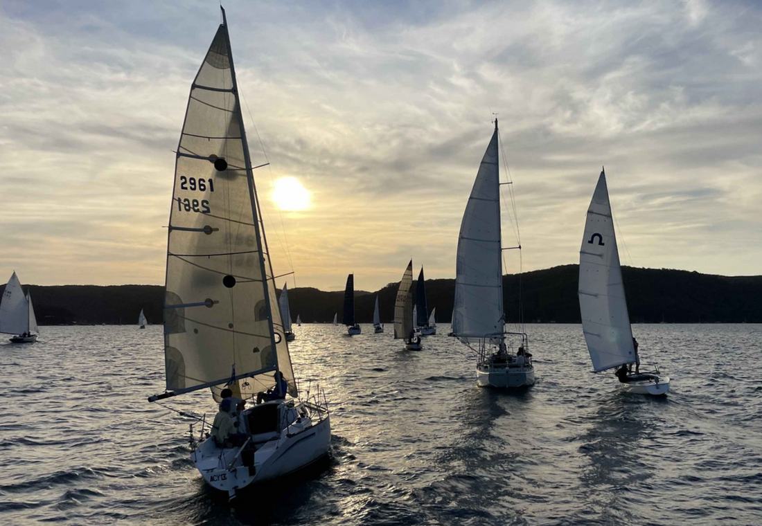 Yachts racing on Pittwater at golden hour