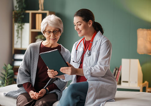 Female patient listening to a doctor in hospital.jpg