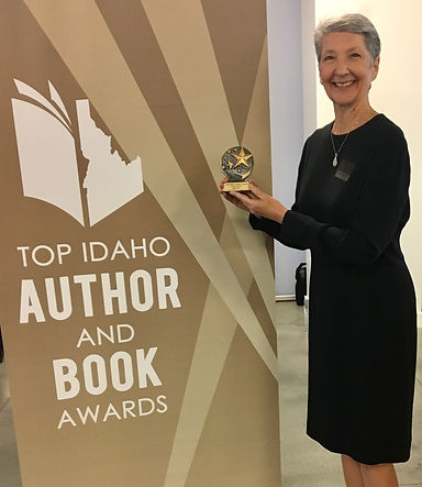 Author, Laurie Buchanan, receiving Top Idaho Author and Book Award