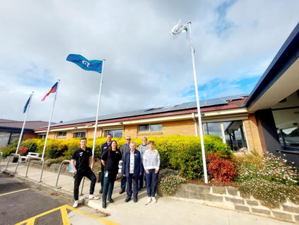 Diversity and Inclusion Committee Chair Vince with Co-CEOs Joel and Kate, alongside members of the Greenhills Community Benevolent Society – Peter, Joy, Jenny, and Sharon – during the unveiling of Carinya’s new flag poles.