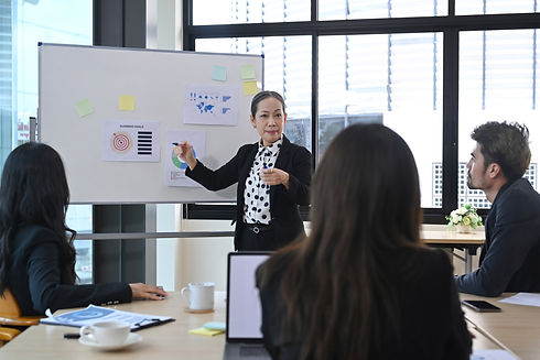 female interim manager leading a meeting